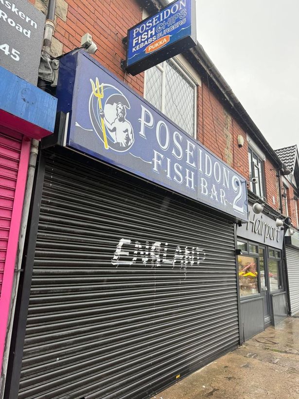 Two ladies offered to help the owner paint over the graffiti as locals react to protect the popular takeaway owner
