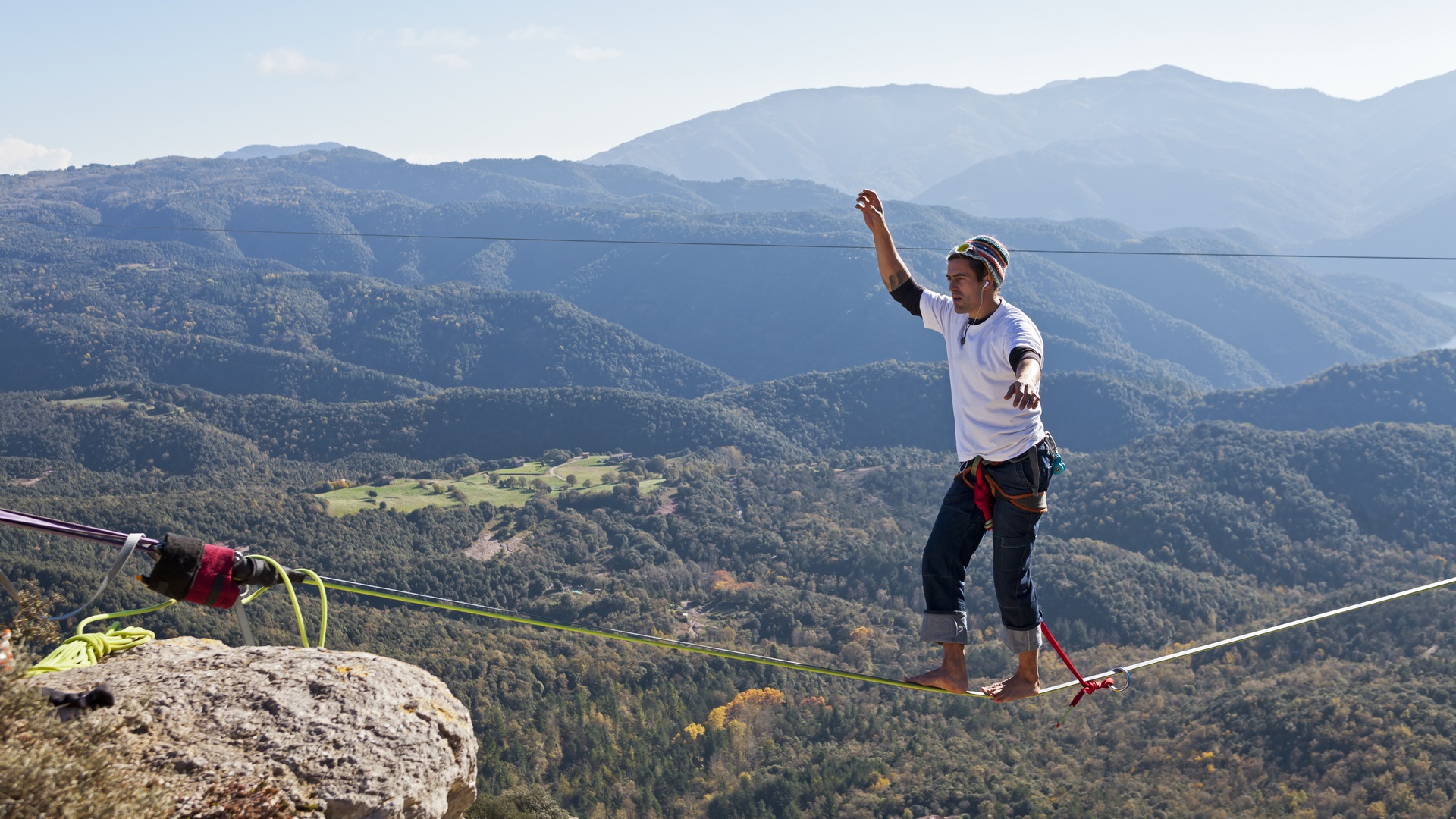 TAVERTET - NOVEMBER 16: Man doing highline in Tavertet, Spain on November 16, 2014. Highline is a balance sport that consists walking through a rope clamped between two points and great height below.