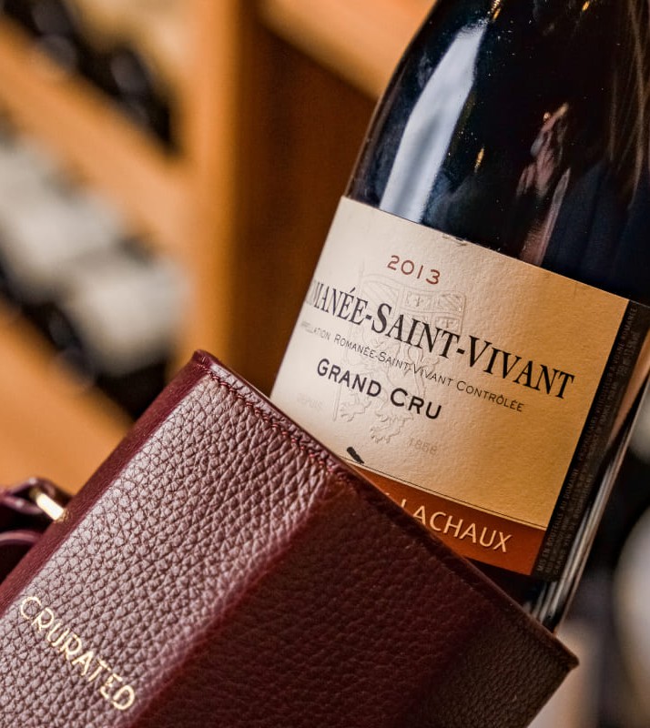 A wine bottle coming out of a Crurated package