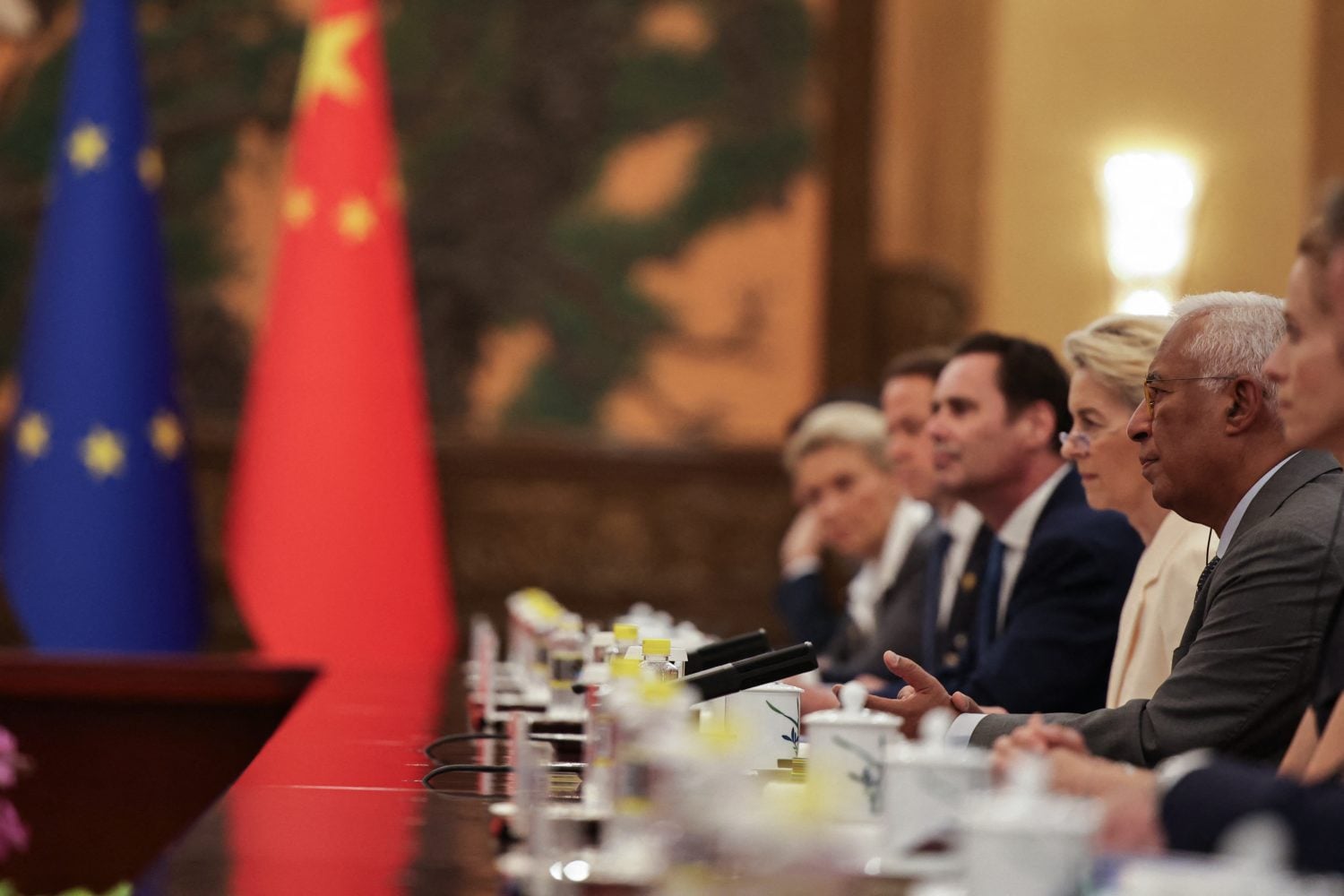 Von der Leyen and EU officials listen to Chinese President Xi Jinping in Beijing