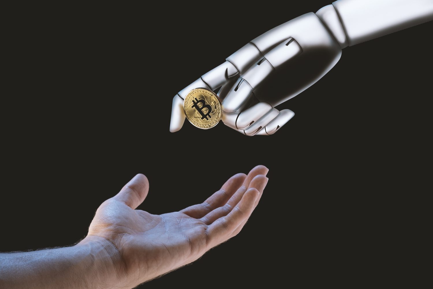 Robot hand giving a Bitcoin to an human hand on a black background.