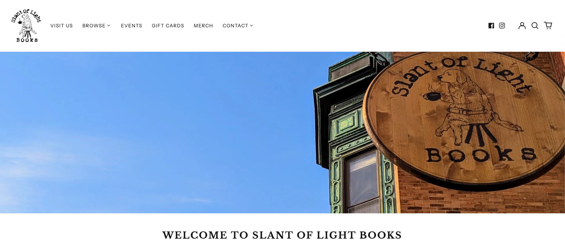 Slant of Light Books website with sign showing a dog drinking coffee against a blue sky.