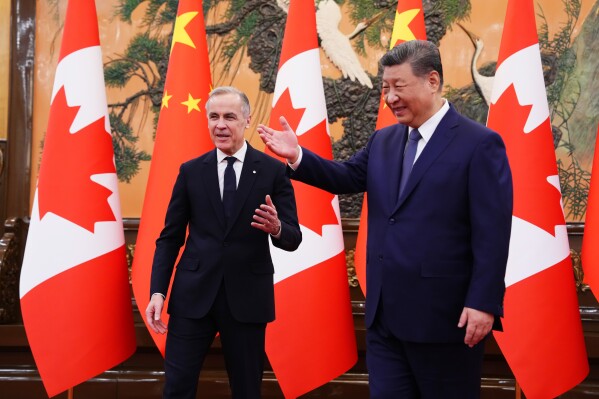 Canadian Prime Minister Mark Carney, left, meets with President of China Xi Jinping at the Great Hall of the People in Beijing, China, on Friday, Jan. 16, 2026. (Sean Kilpatrick/The Canadian Press via AP)