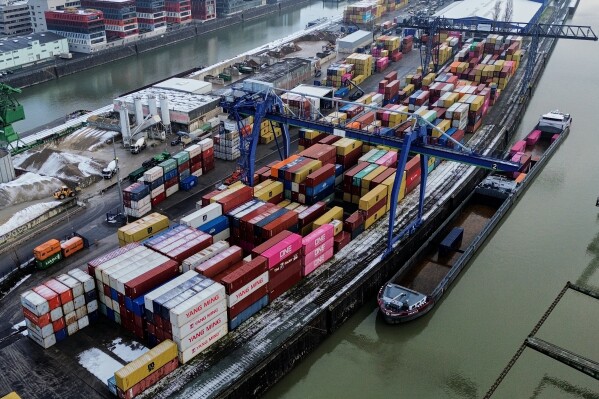 Containers are piled up in Frankfurt, Germany, Friday, Jan. 30, 2026. (AP Photo/Michael Probst)