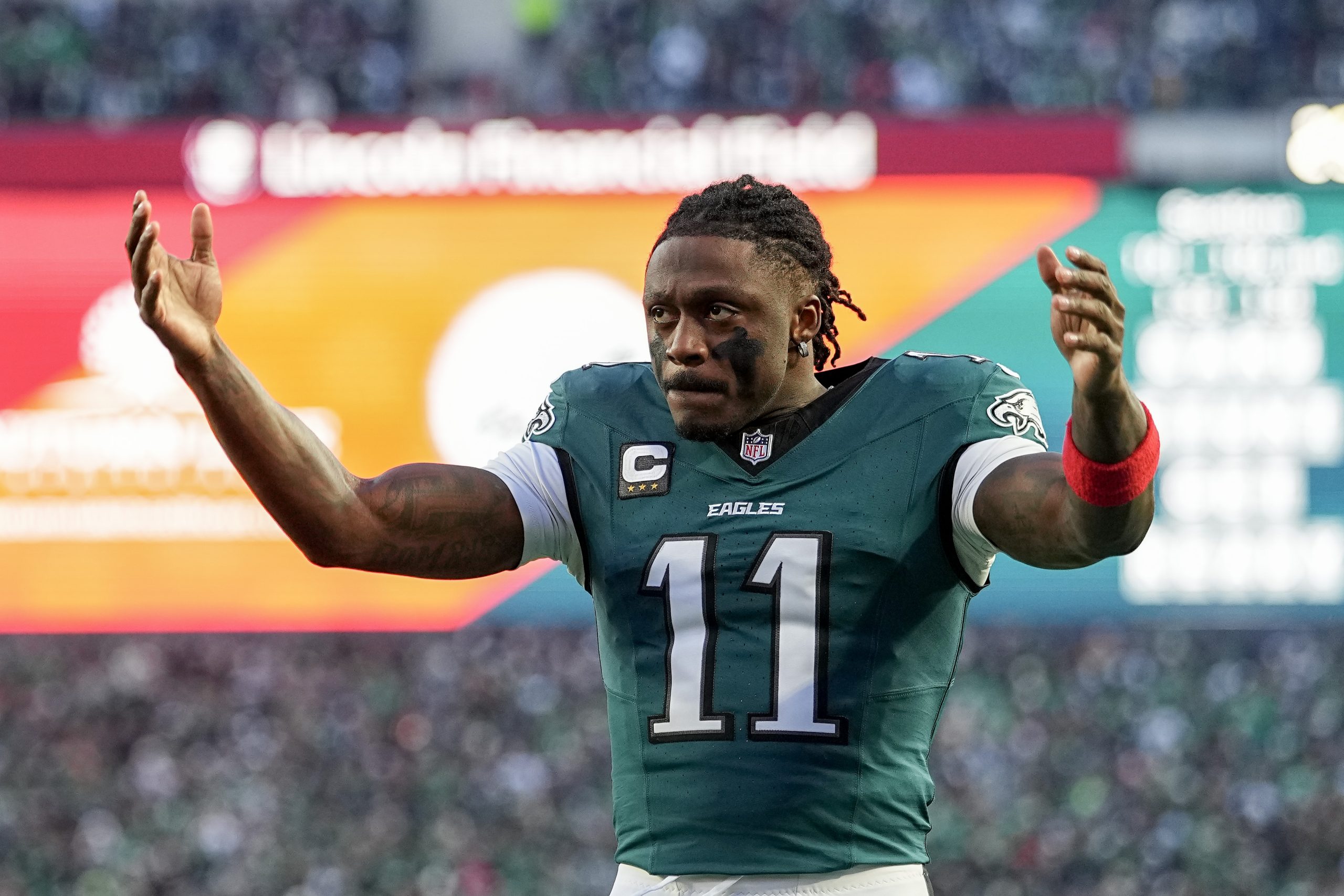 A.J. Brown #11 of the Philadelphia Eagles pumps up the crowd before the NFC Wild Card Playoff game against the San Francisco 49ers at Lincoln Financial Field on January 11, 2026 in Philadelphia, Pennsylvania.
