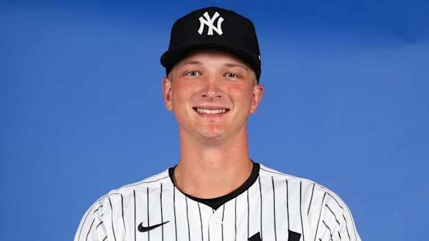 New York Yankees T.J. Rumfield smiling while posing for a pictur