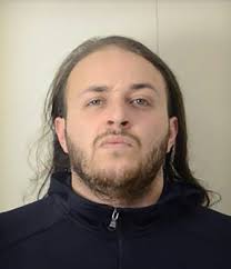 Mugshot of Badiss Mohamed Amide Bajjou, a Franco-Moroccan man.