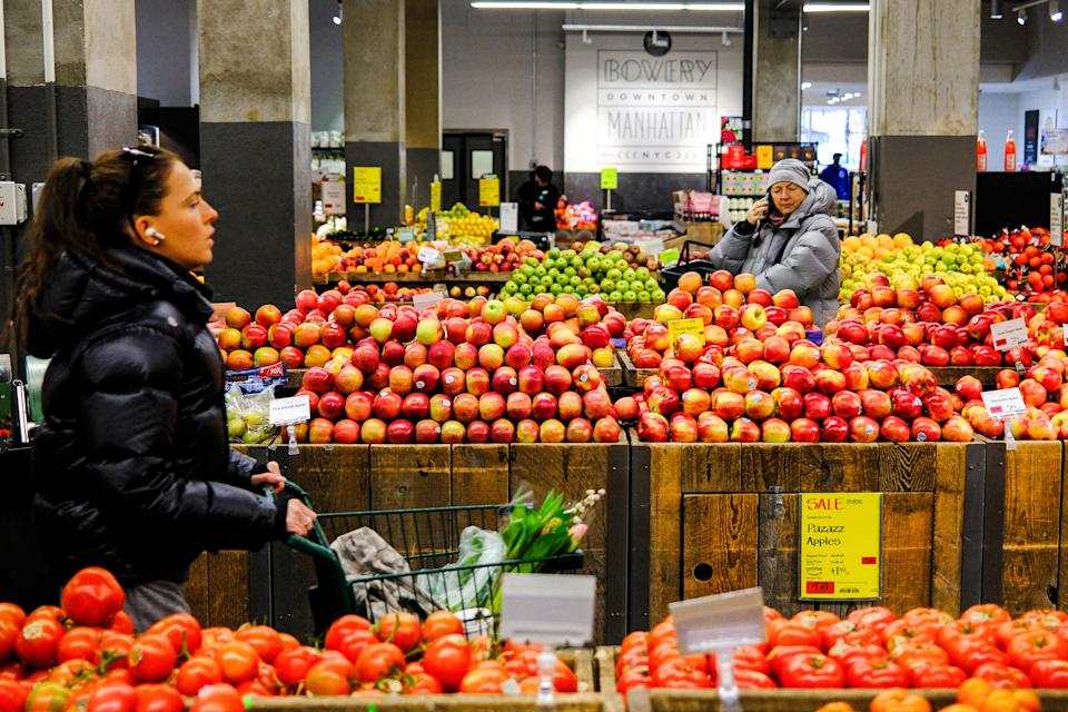 Customers shop for fruit in a supermarket in New York City on Jan. 22. (Charly Triballeut/AFP via Getty Images)