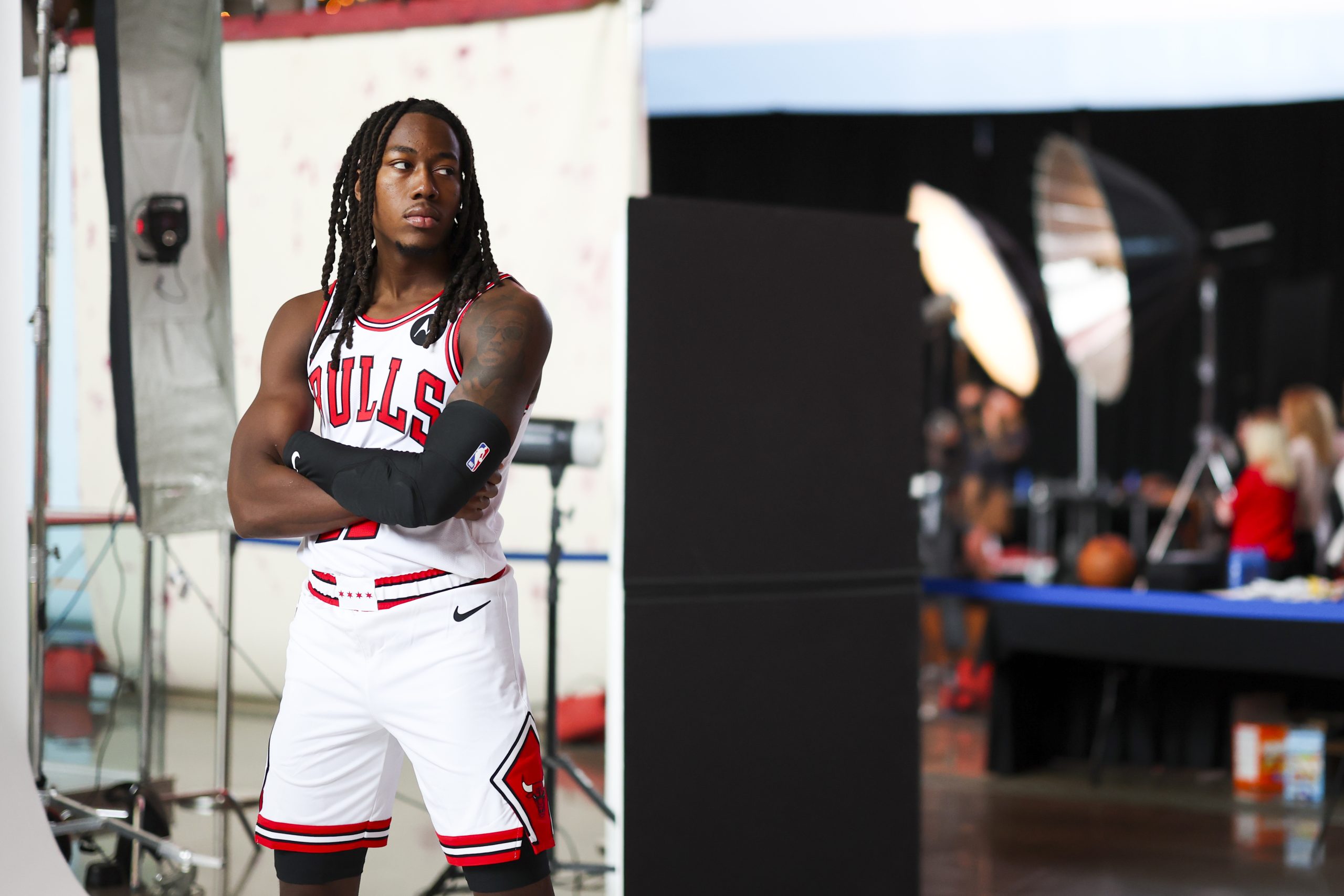 Bulls guard Ayo Dosunmu poses for photos during media day...