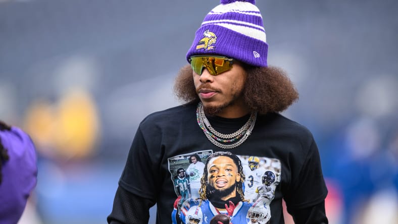 Justin Jefferson warms up wearing a Damar Hamlin tribute shirt before a Vikings game.