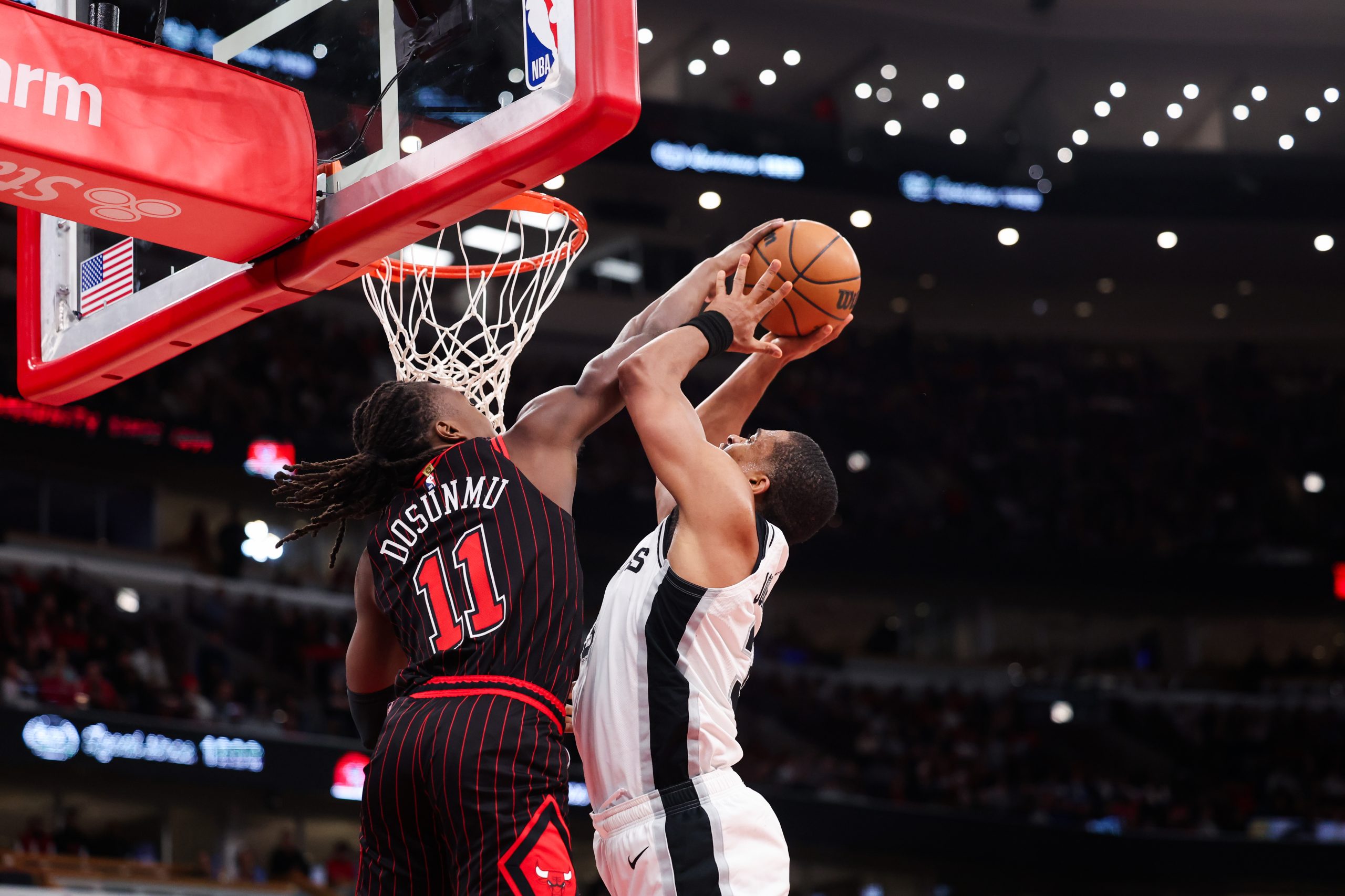 Chicago Bulls guard Ayo Dosunmu (11) guards San Antonio Spurs...