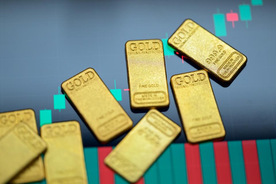 Gold bars are displayed in a photo illustration, reflecting recent movements in gold prices driven by inflation concerns and central bank policy outlooks. (Jonathan Raa/NurPhoto via Getty Images)