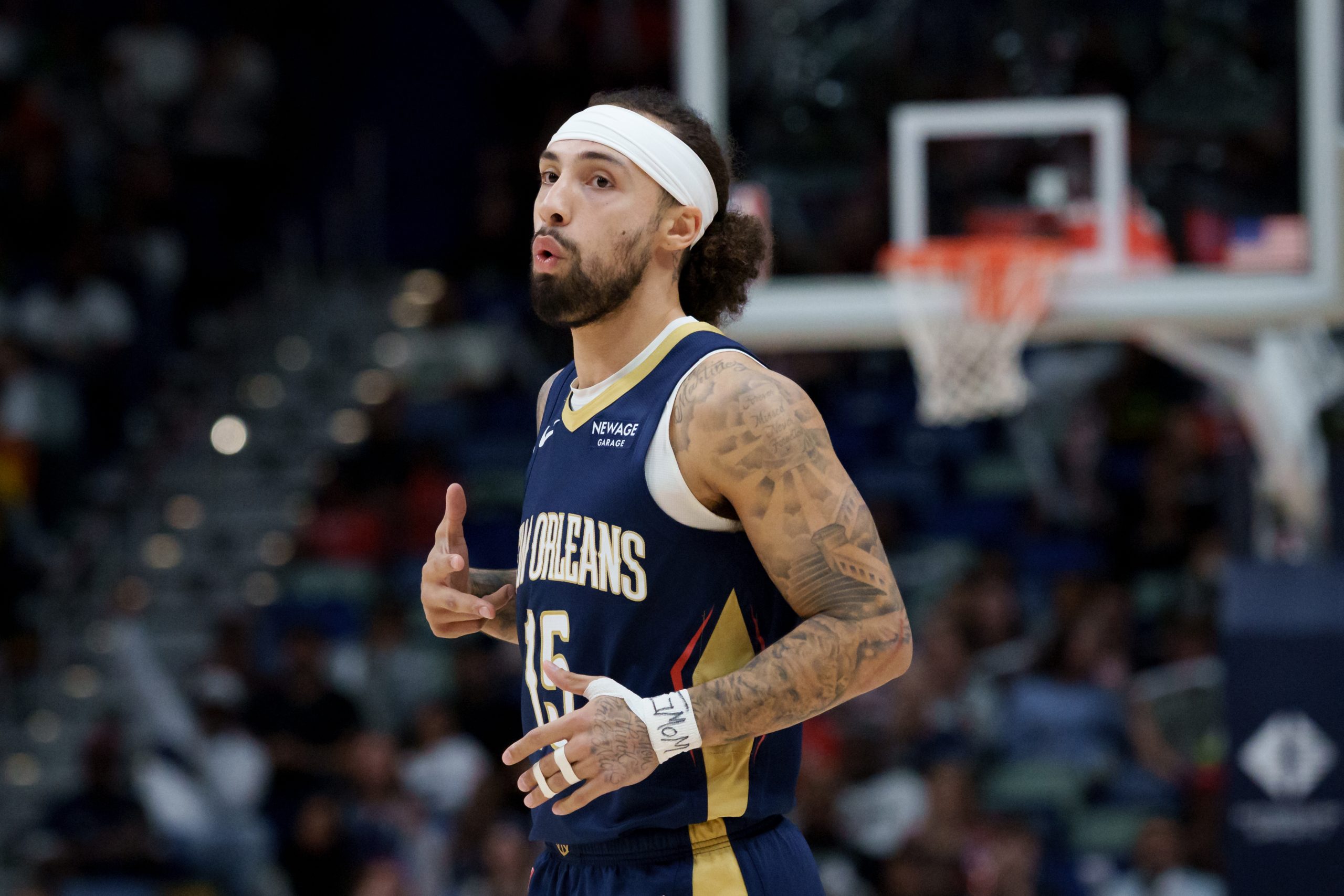 New Orleans Pelicans guard Jose Alvarado reacts after scoring a three-point basket during a basketball game against the Phoenix Suns.