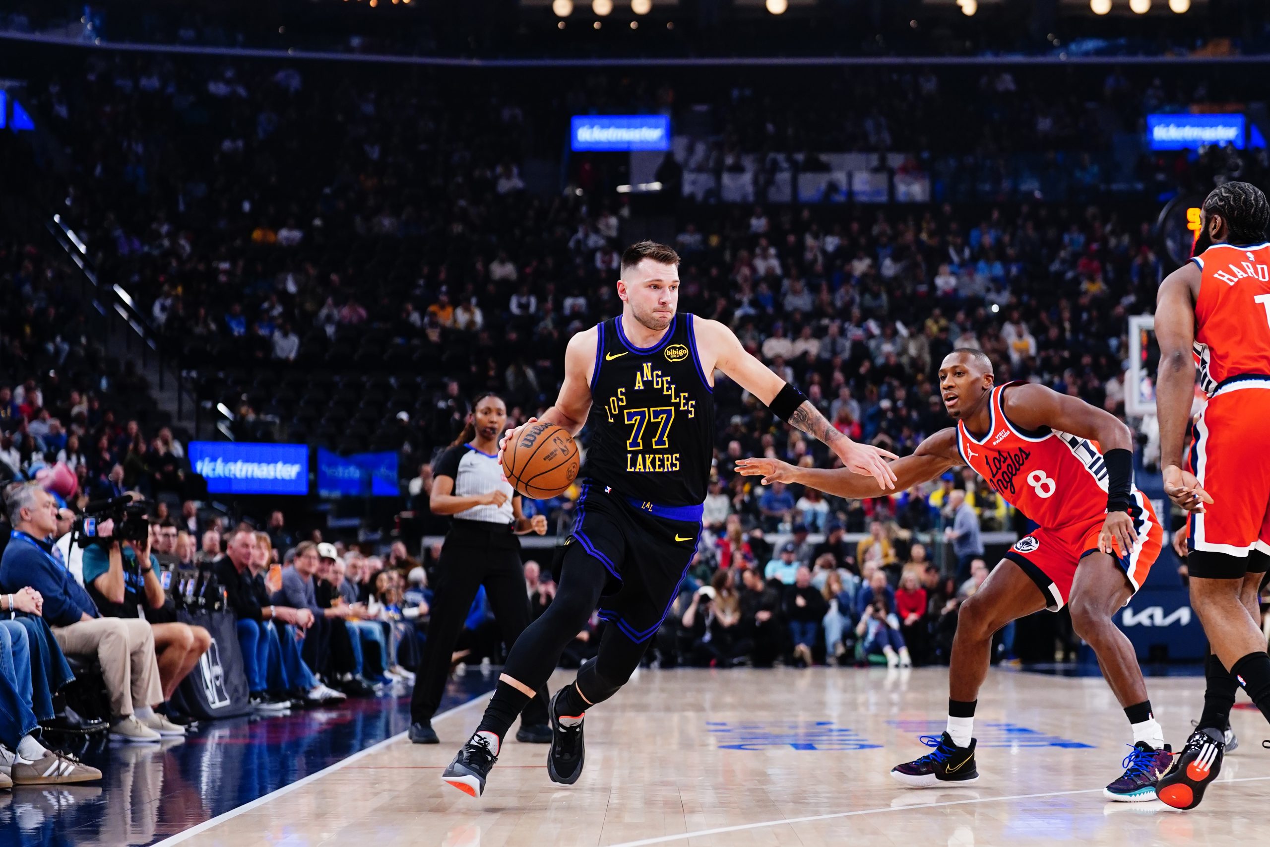 Luka Doncic #77 of the Los Angeles Lakers dribbles the ball against the LA Clippers.